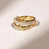 Gold and silver-tone interlocking rings close up