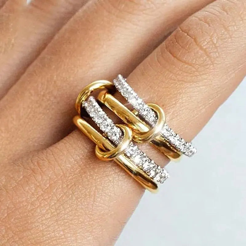 Two-tone stacking ring set worn on the hand