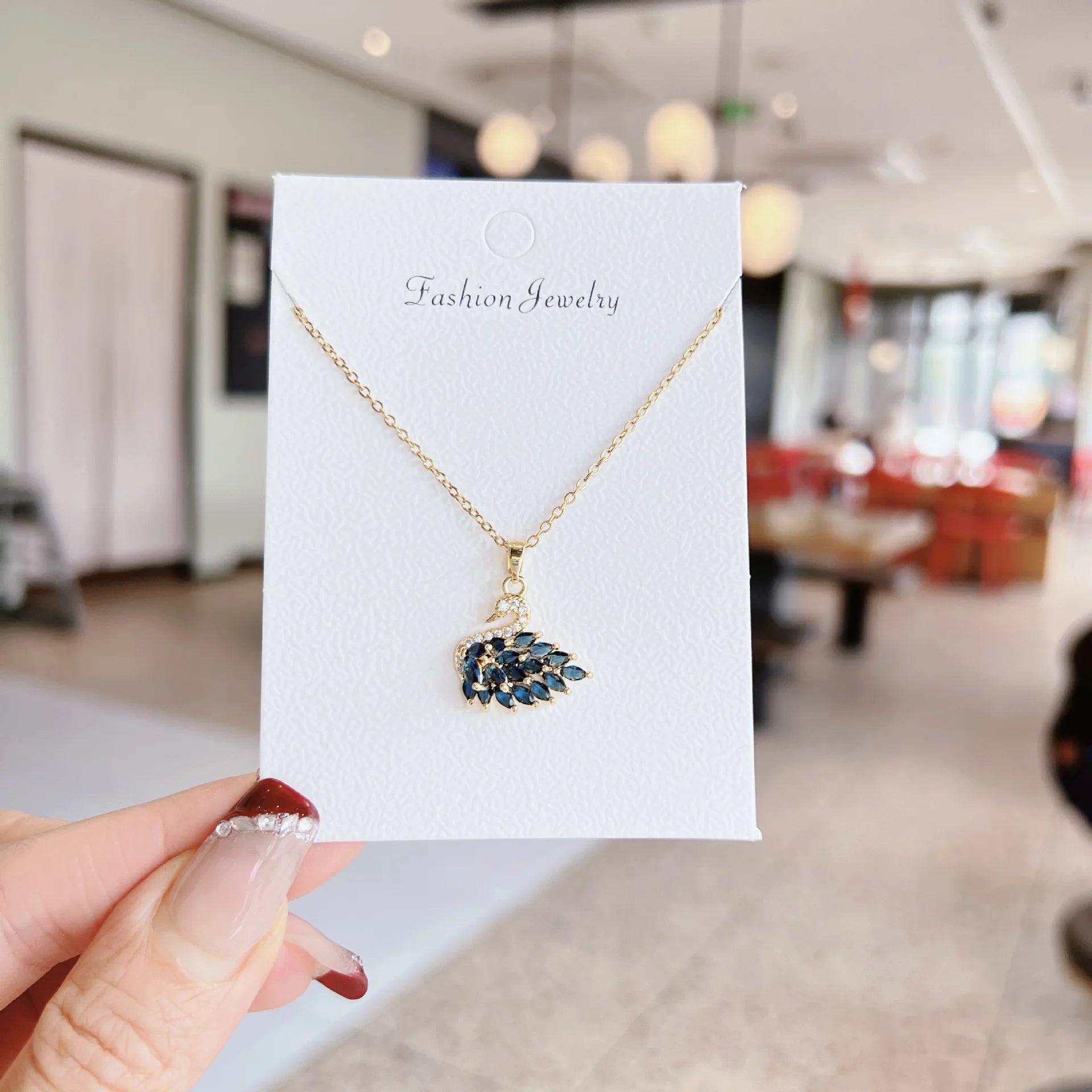 Gold crystal swan necklace, navy