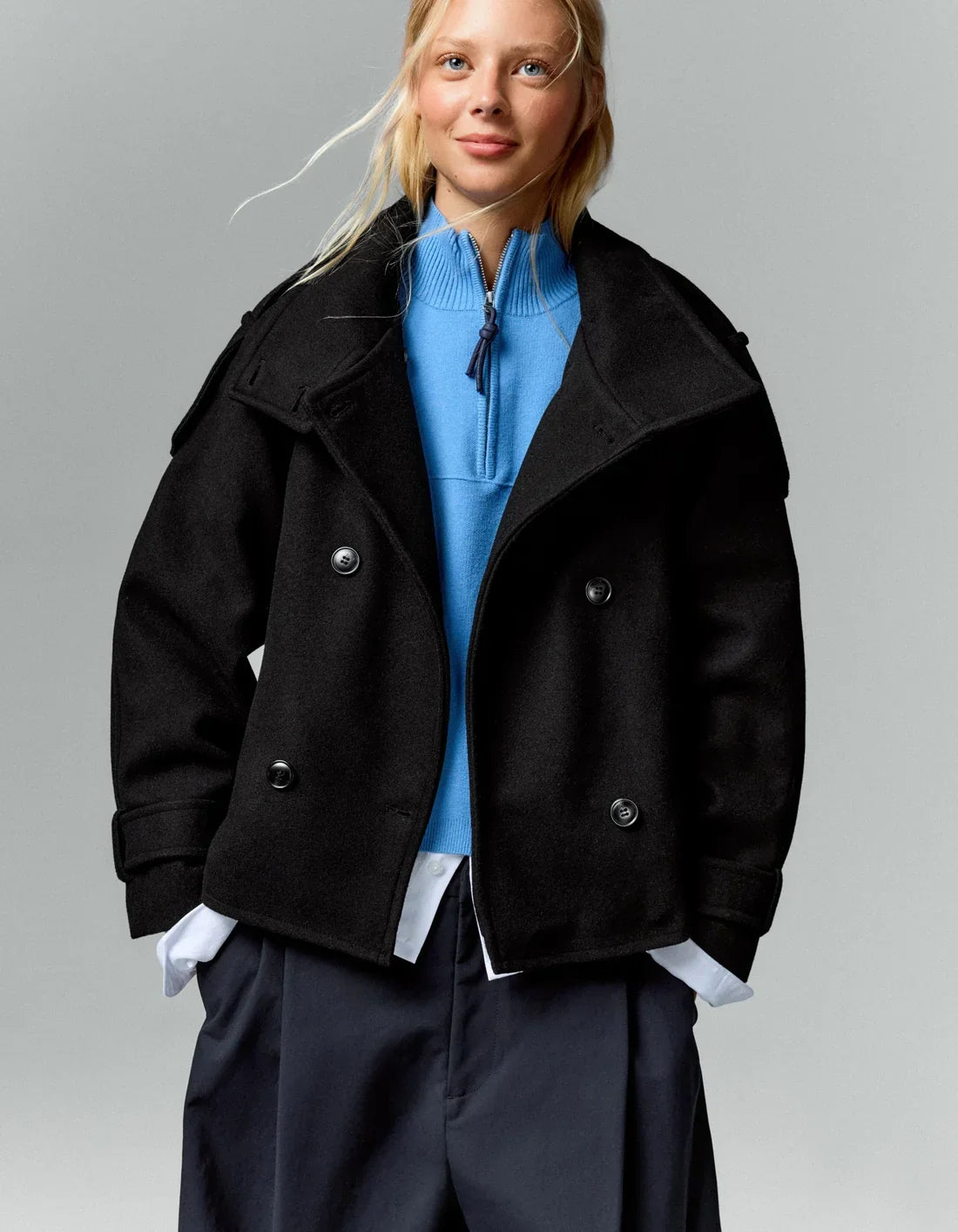 Mazarine coat in black, worn open