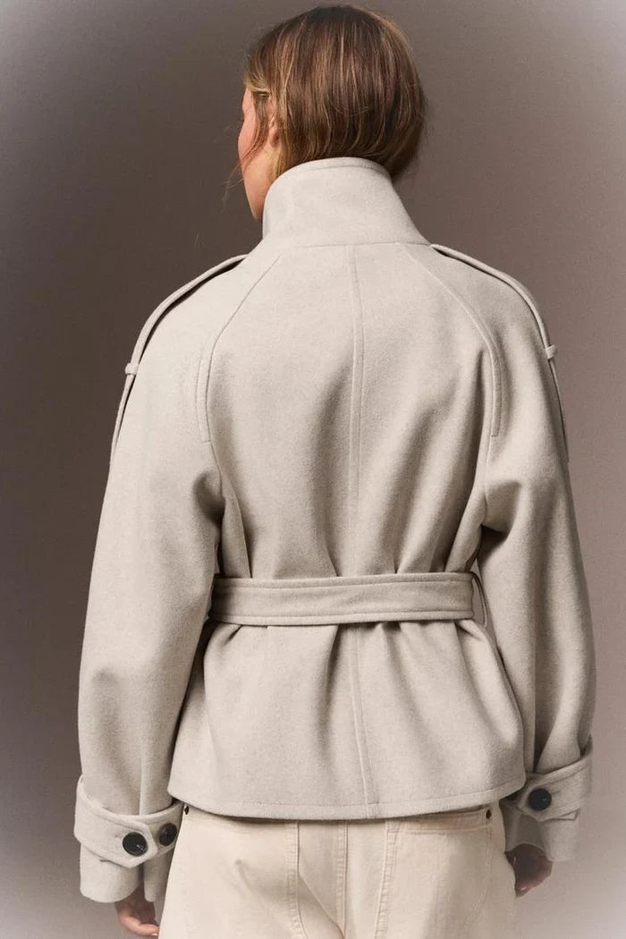 Back of the cream Mazarine coat with belt