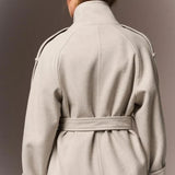 Back of the cream Mazarine coat with belt
