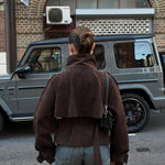 Back of the brown cropped belted jacket