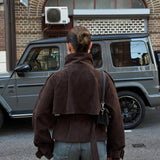 Back of the brown cropped belted jacket