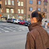 Side view of the brown cropped jacket